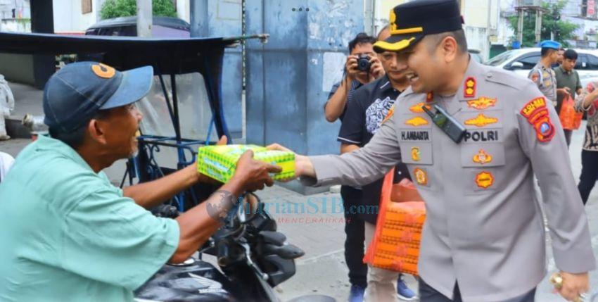 Polres Tebingtinggi Bagikan Ratusan Naskot kepada Parbetor
